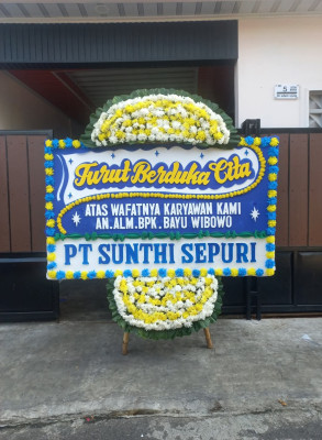 Papan Bunga Duka di Molanikime