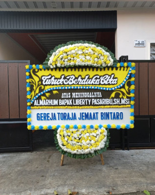 Papan Bunga Duka di Molanikime